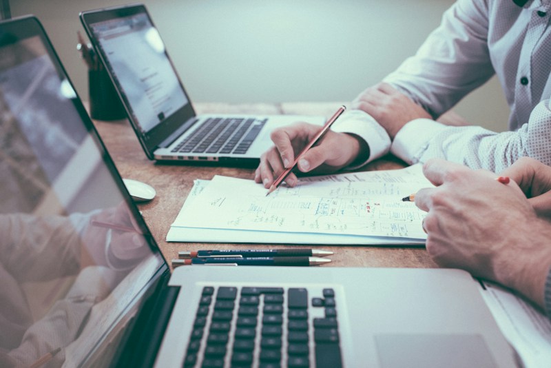 Advisor reviewing documents during a financial planning discussion